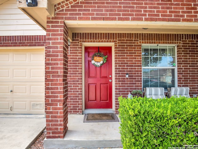 property entrance with a garage