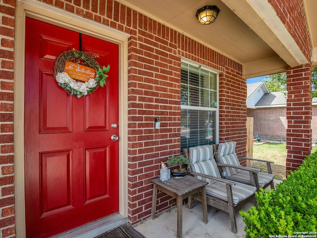 doorway to property featuring covered porch