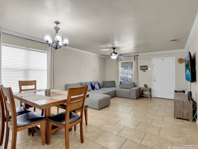 dining space featuring a textured ceiling, crown molding, light tile patterned floors, and ceiling fan with notable chandelier