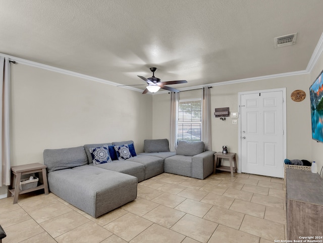 living room with light tile patterned floors, a textured ceiling, ceiling fan, and crown molding