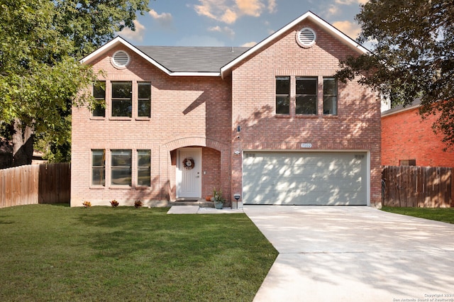 view of front property featuring a front yard and a garage