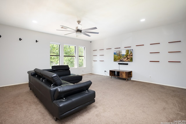 carpeted living room featuring ceiling fan