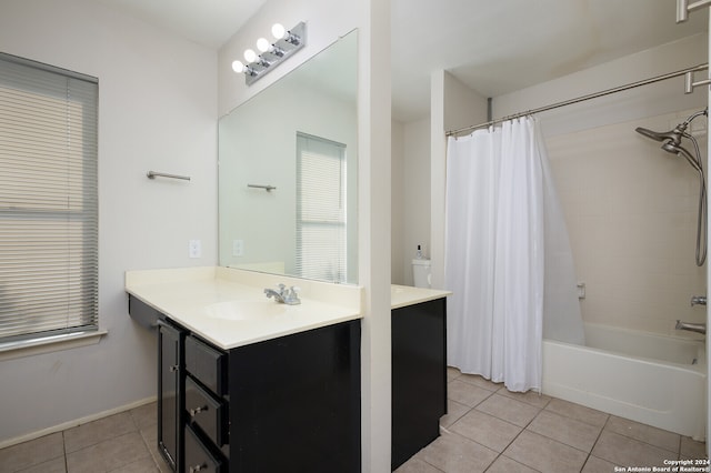 bathroom featuring tile patterned flooring, vanity, and shower / bath combination with curtain