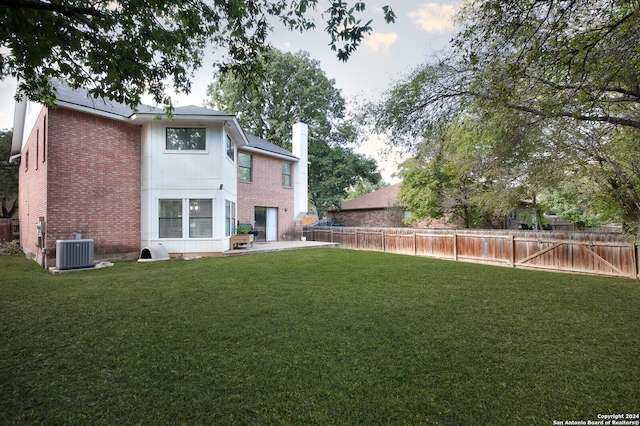 view of yard featuring central air condition unit