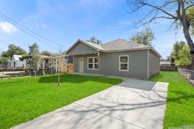 view of front of house featuring a patio area and a front yard