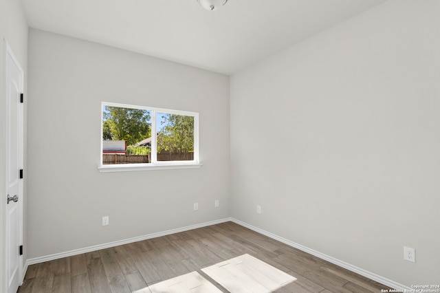 spare room with light wood-type flooring