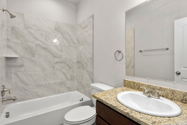 full bathroom with tiled shower / bath combo, toilet, and vanity