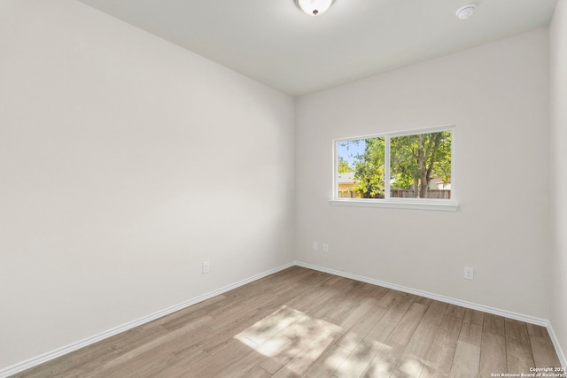 empty room with light hardwood / wood-style floors