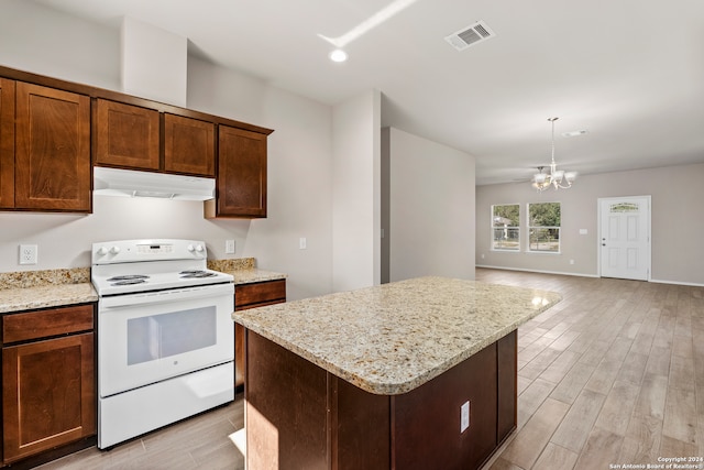 kitchen featuring a chandelier, light hardwood / wood-style floors, white range with electric stovetop, and hanging light fixtures