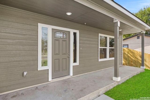 property entrance featuring covered porch