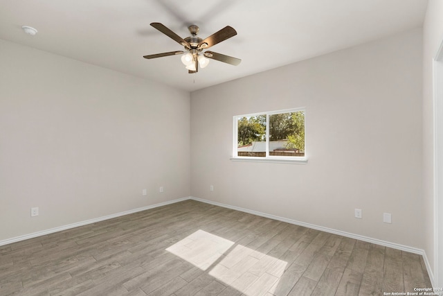 unfurnished room featuring ceiling fan and light wood-type flooring