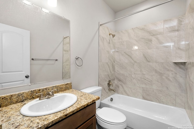 full bathroom with vanity, toilet, and tiled shower / bath