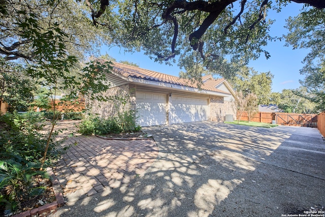 view of property exterior featuring a garage