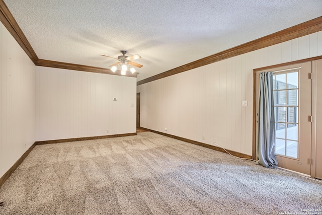 empty room with light carpet, a textured ceiling, ceiling fan, and ornamental molding