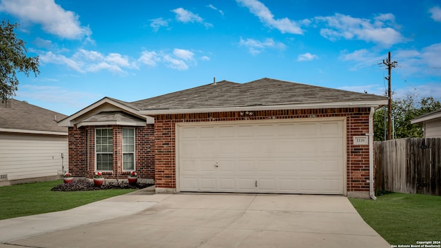 ranch-style house featuring a garage and a front lawn