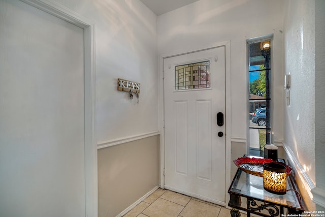 entryway featuring light tile patterned floors