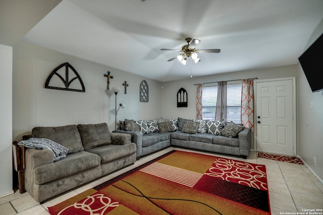 tiled living room with ceiling fan