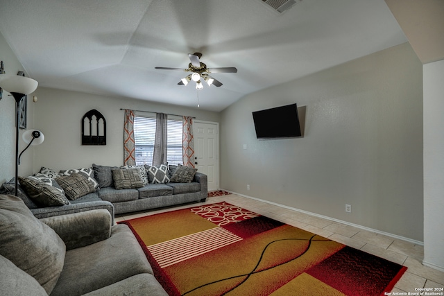 living room featuring vaulted ceiling, ceiling fan, and light tile patterned flooring