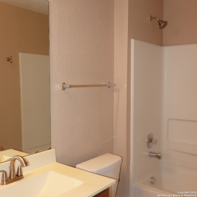 full bathroom with shower / bathing tub combination, vanity, and toilet