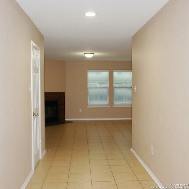 corridor featuring light tile patterned flooring