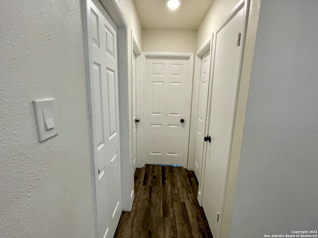 corridor featuring dark hardwood / wood-style flooring