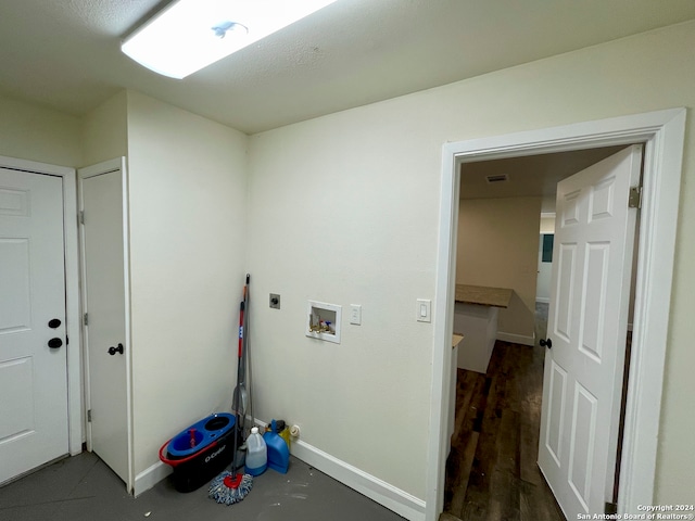 laundry room with washer hookup, electric dryer hookup, and dark wood-type flooring