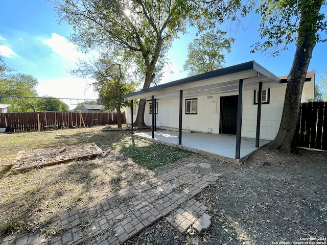 rear view of property with a patio