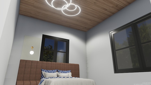 bedroom featuring lofted ceiling and wood ceiling