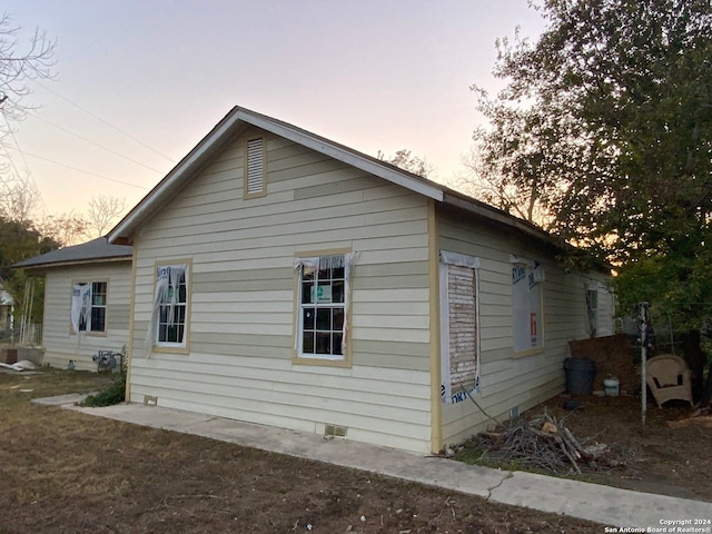 view of property exterior at dusk