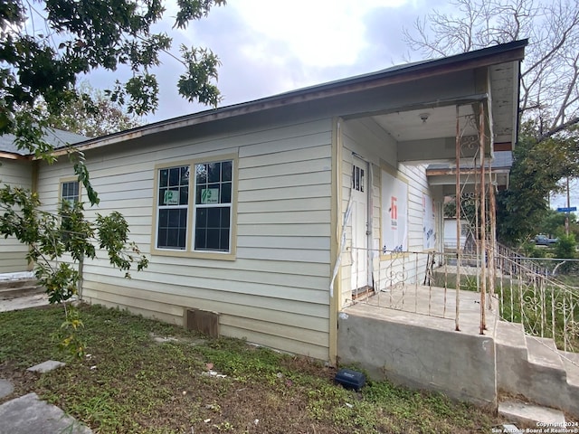 view of home's exterior featuring covered porch