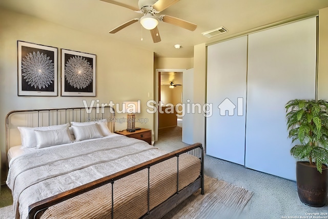 carpeted bedroom with ceiling fan and a closet