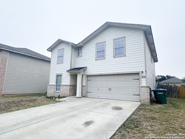 front of property with a garage