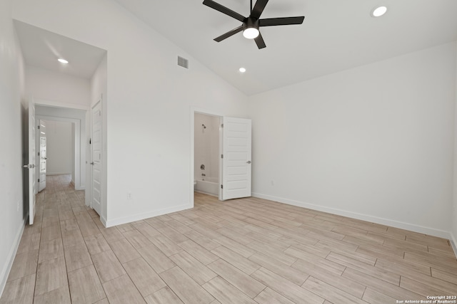 unfurnished bedroom featuring ceiling fan, light hardwood / wood-style floors, and high vaulted ceiling