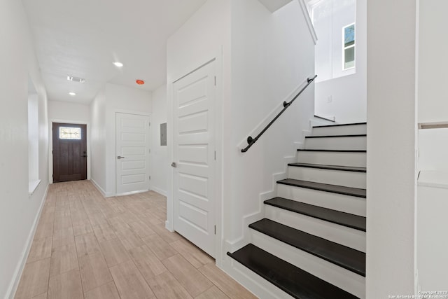 stairway featuring wood-type flooring