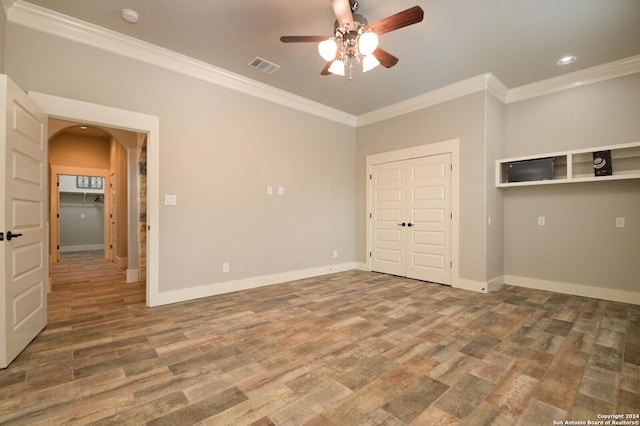 2407 Fm 1283, Pipe Creek, TX 78063 - spare room with ornamental molding, ceiling fan, arched walkways, wood finished floors, and a smoke detector
