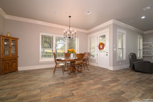 dining area featuring an inviting chandelier, crown molding, and dark wood-type flooring