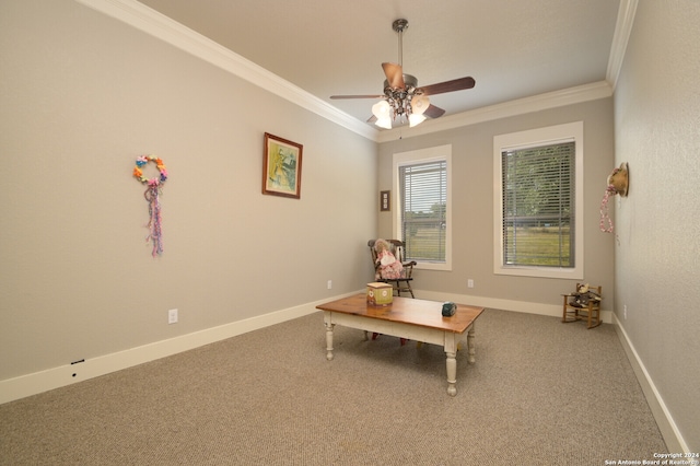 interior space with carpet floors, ceiling fan, and crown molding