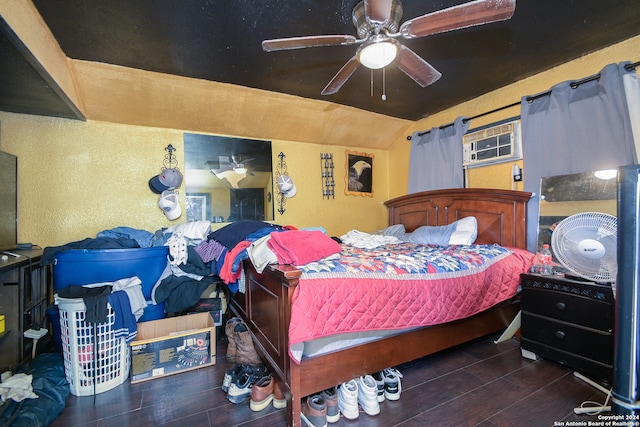 bedroom with dark hardwood / wood-style flooring, ceiling fan, and lofted ceiling