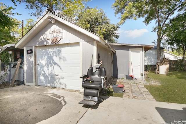 garage featuring a yard