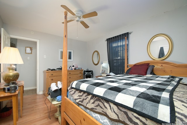 bedroom with ceiling fan and light hardwood / wood-style floors