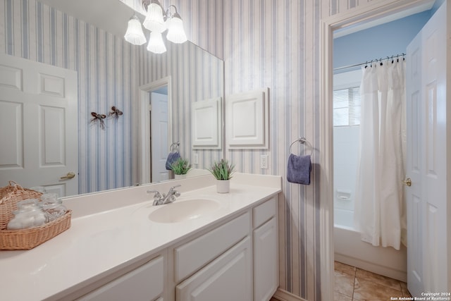 bathroom with vanity, tile patterned floors, a notable chandelier, and shower / tub combo with curtain