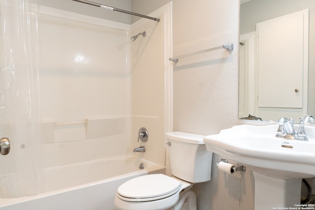 bathroom with toilet and shower / tub combo with curtain