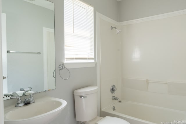 full bathroom with bathing tub / shower combination, sink, and toilet