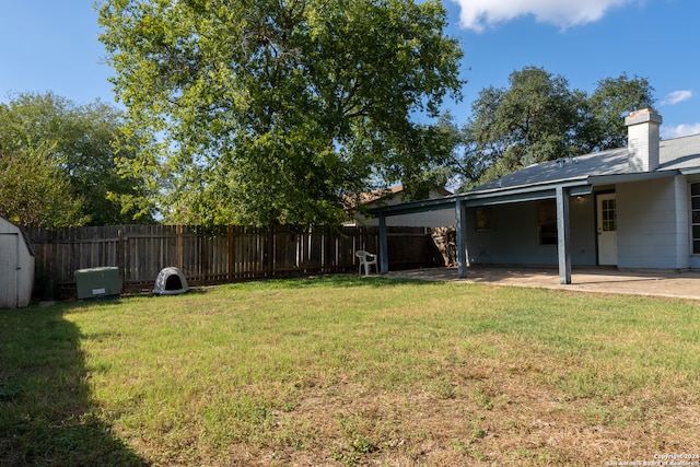 view of yard with a carport and a patio area