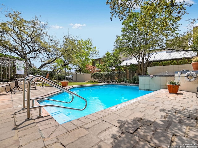 view of pool featuring a patio