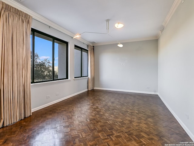 empty room featuring dark parquet floors and ornamental molding