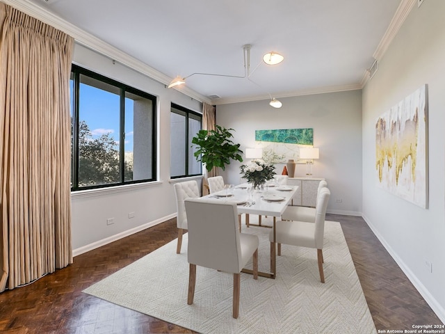 dining area with dark parquet floors and crown molding