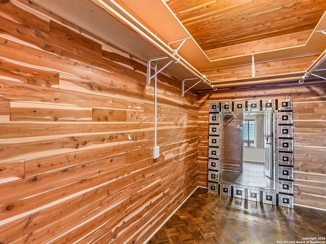 spacious closet featuring parquet flooring