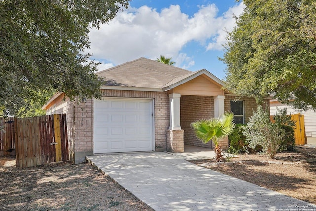 2115 Clear Ct, San Antonio, TX 78227 - view of front of property featuring an attached garage, fence, driveway, and brick siding