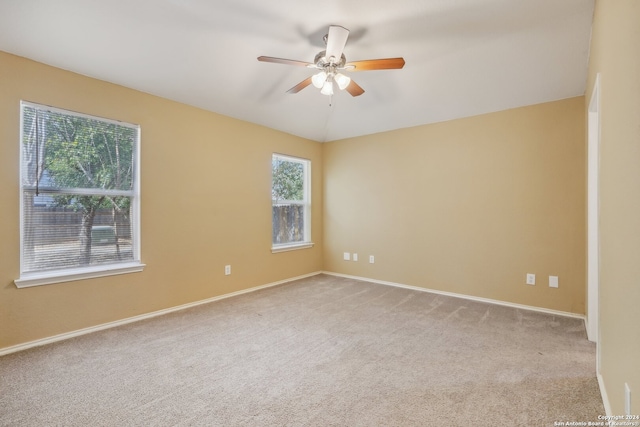 carpeted empty room with ceiling fan